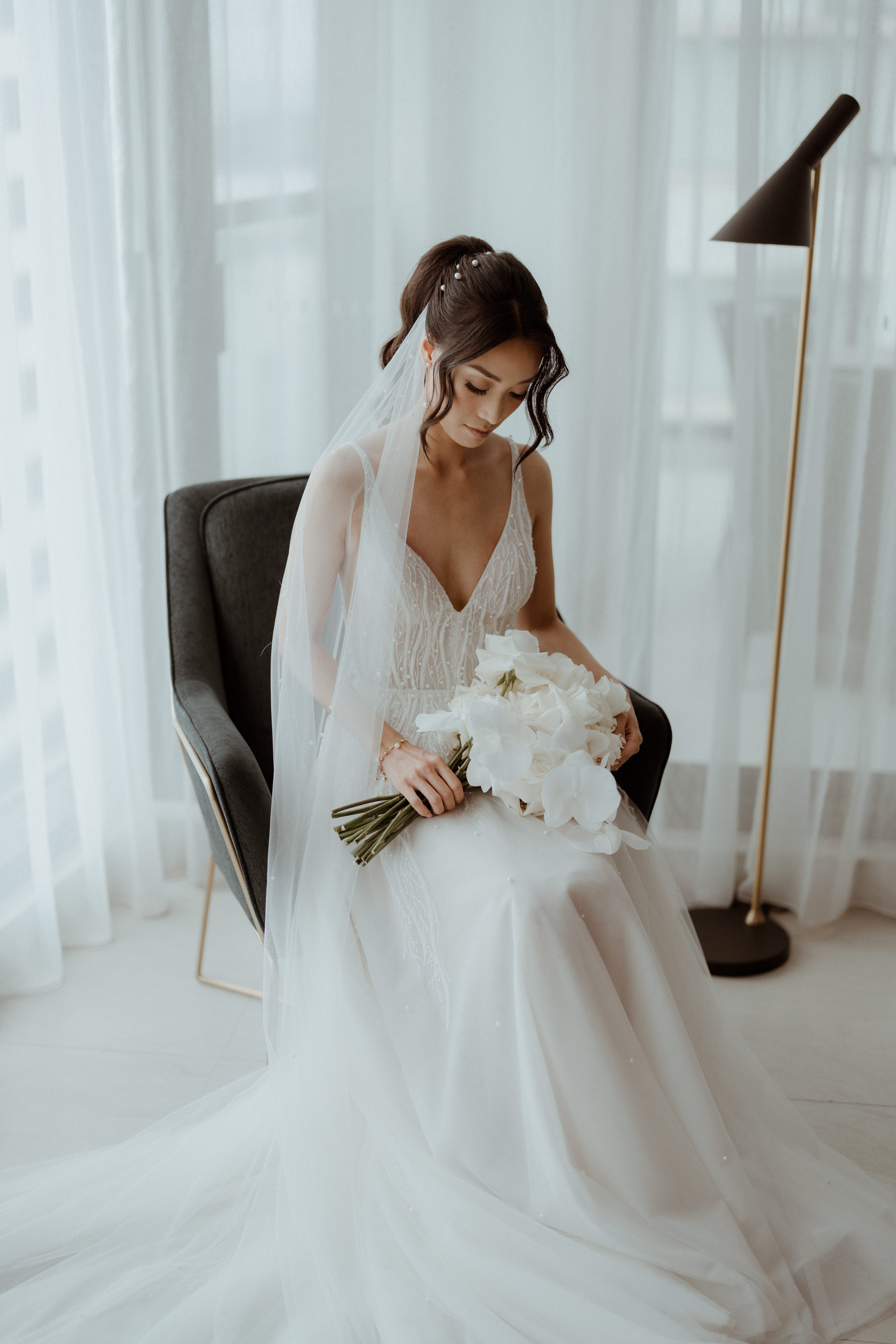 bride wearing wedding veil and gown