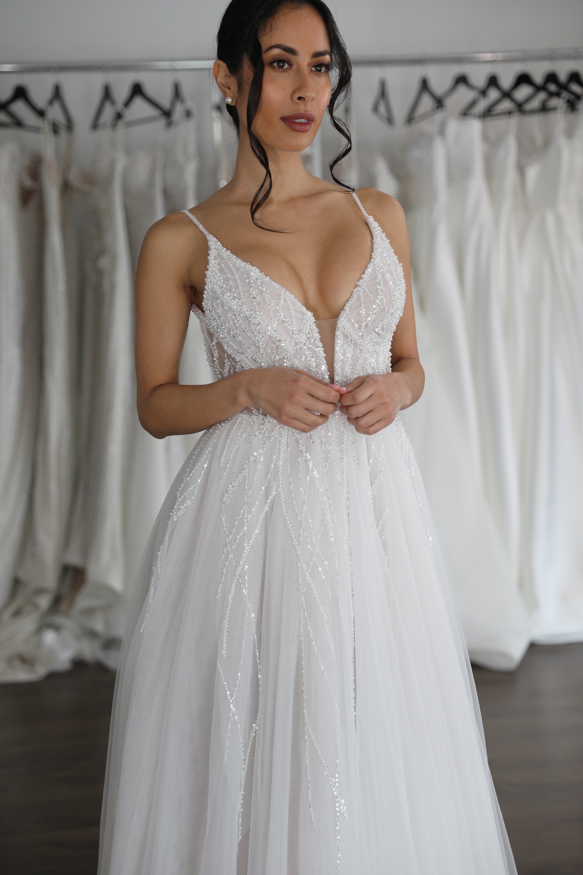 deep v-neck tulle wedding dress with layers of sparkling bridal lace