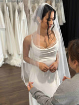 designer fixing brides tulle veil