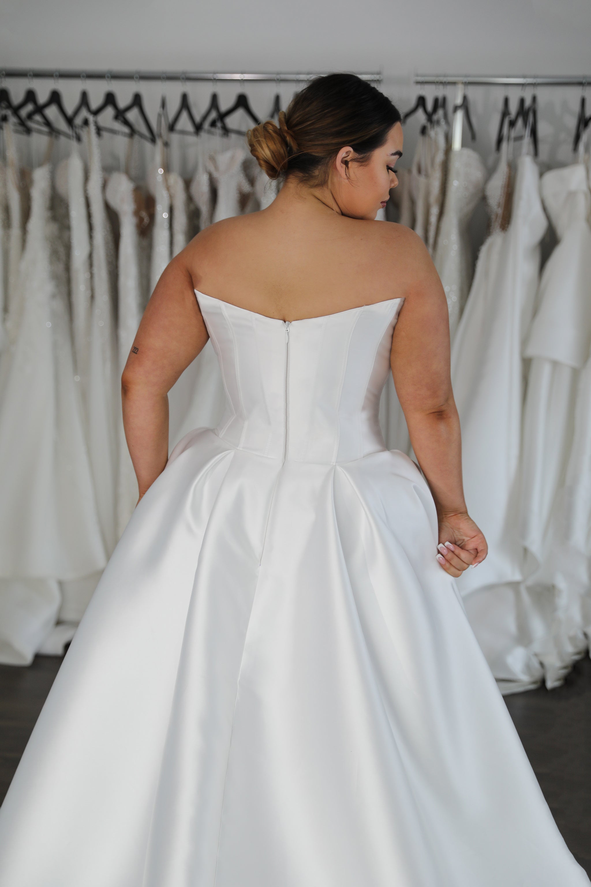 drop waist wedding dress with no straps and curved back