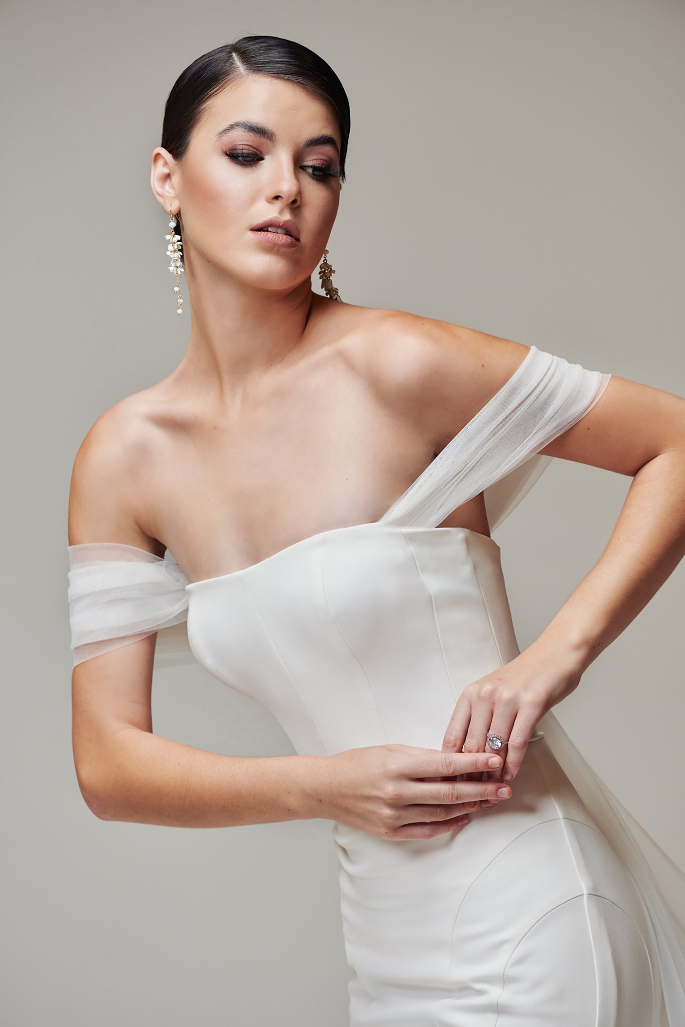 elegant white bridal dress with tulle shoulder straps