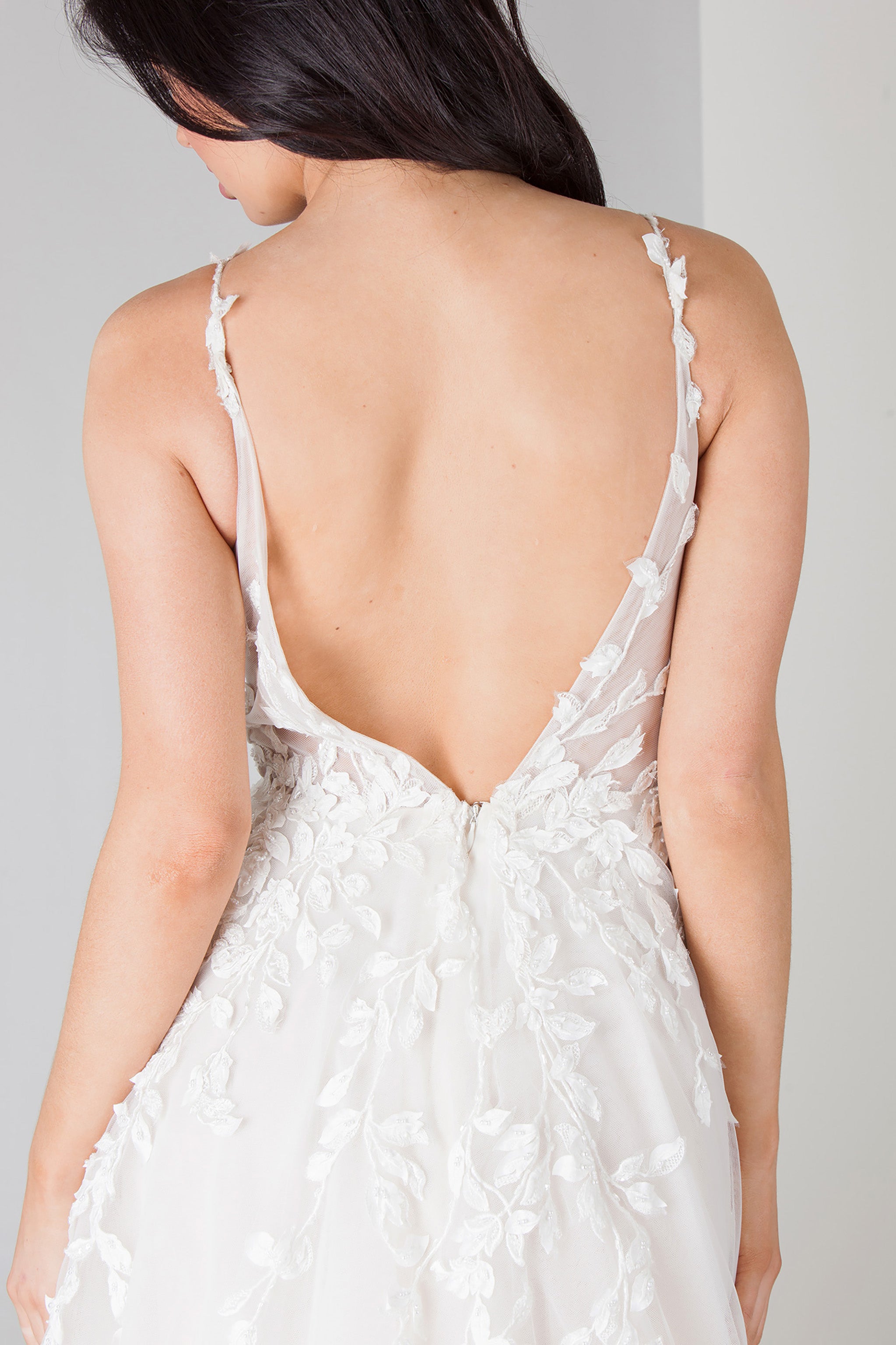exposed back white wedding dress with straps and floral lace