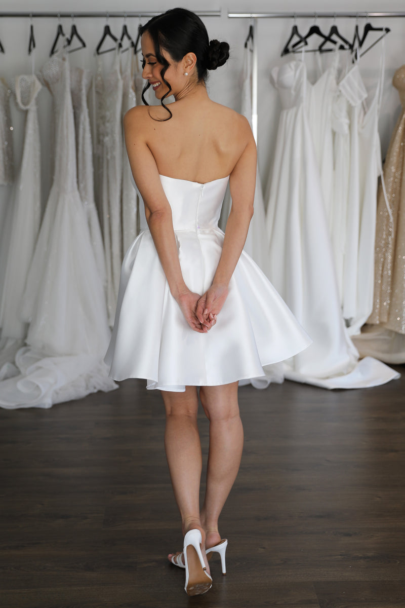flowing skirt on strapless mini wedding gown