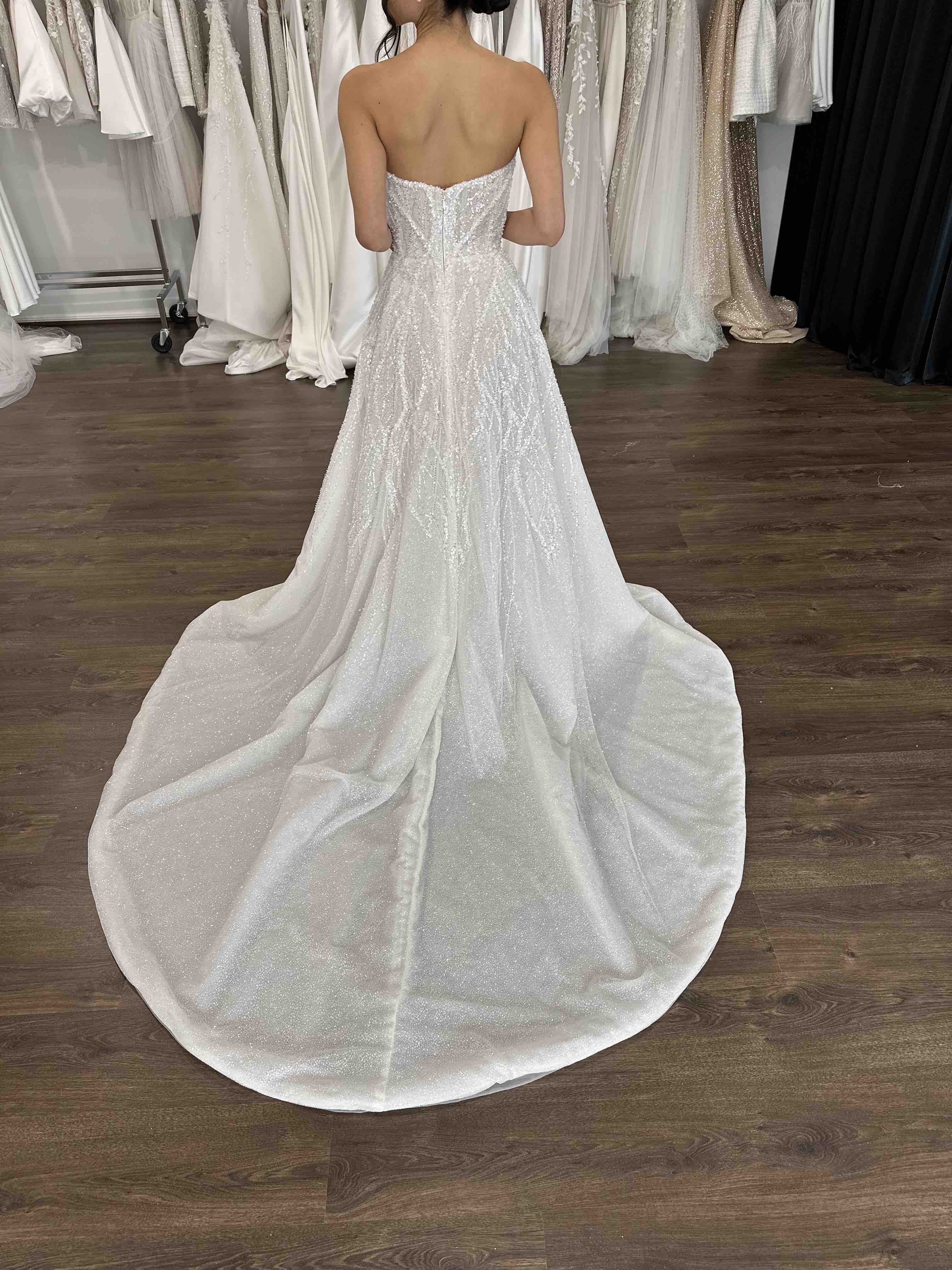 full skirt strapless wedding dress with long flowing dramatic train