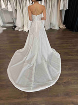 full skirt strapless wedding dress with long flowing dramatic train