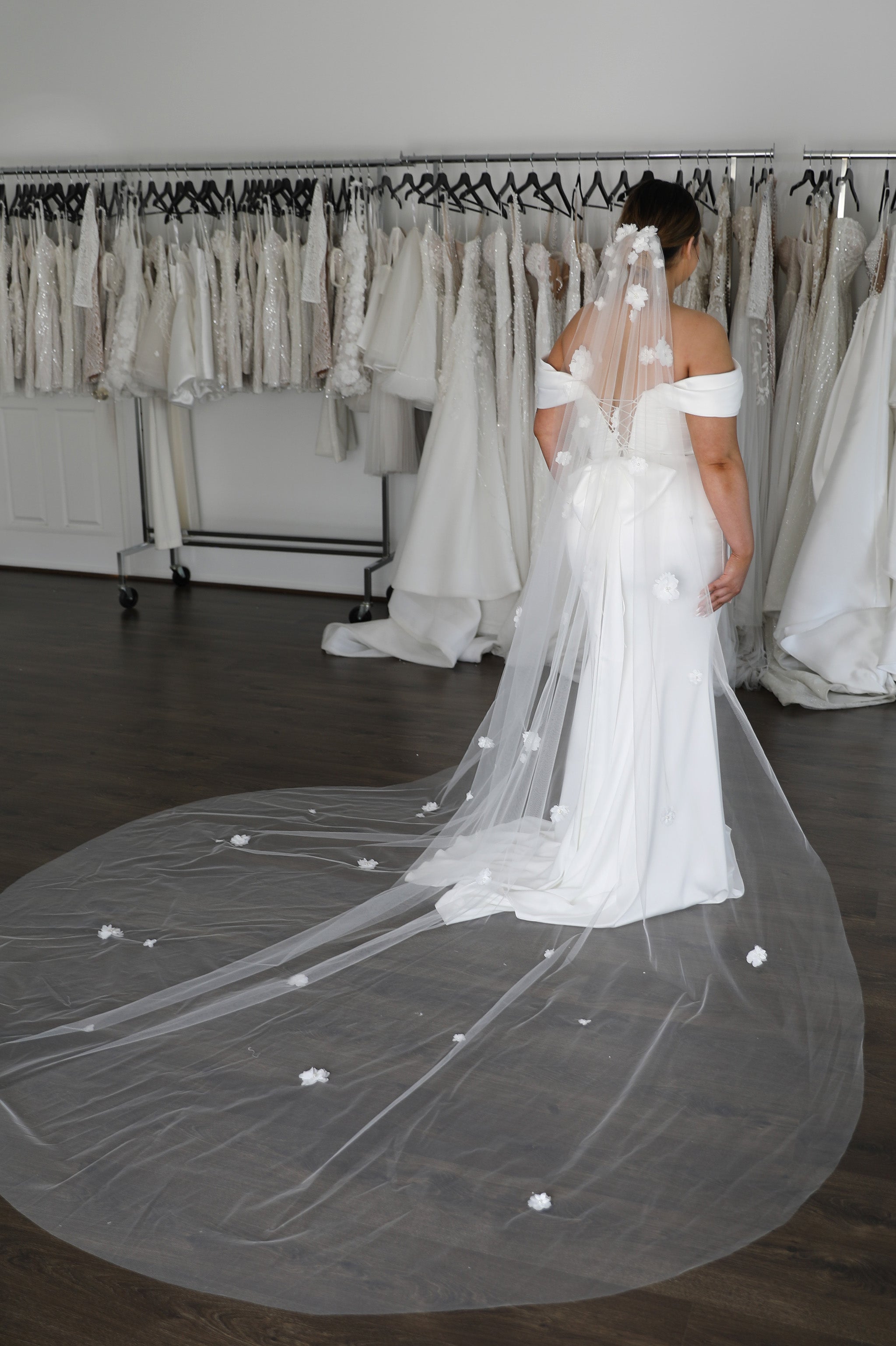 long flowing tulle veil with lace flowers appliqué on it