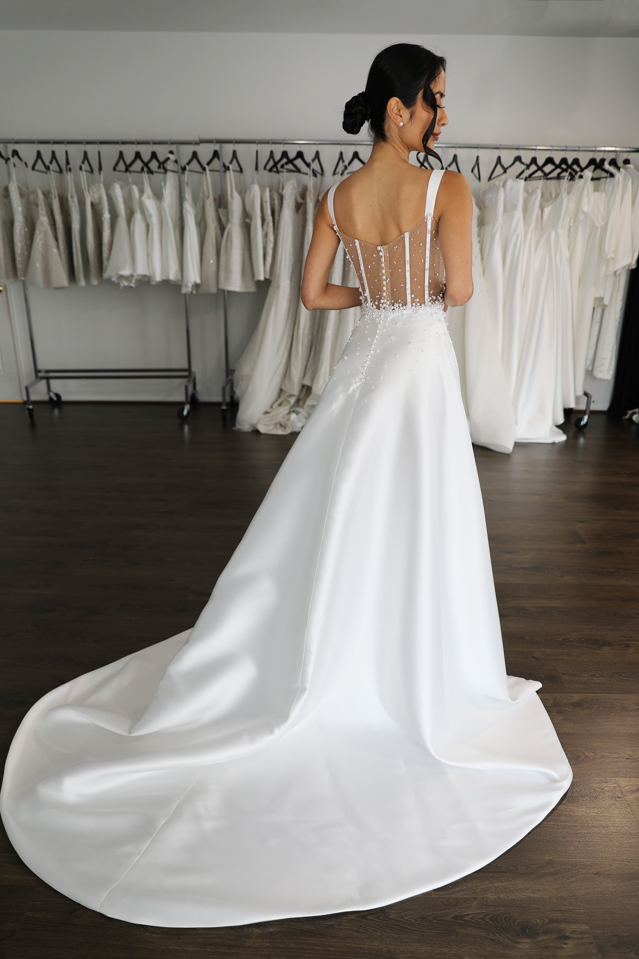 long flowing white mikado wedding dress with pearl embellishments