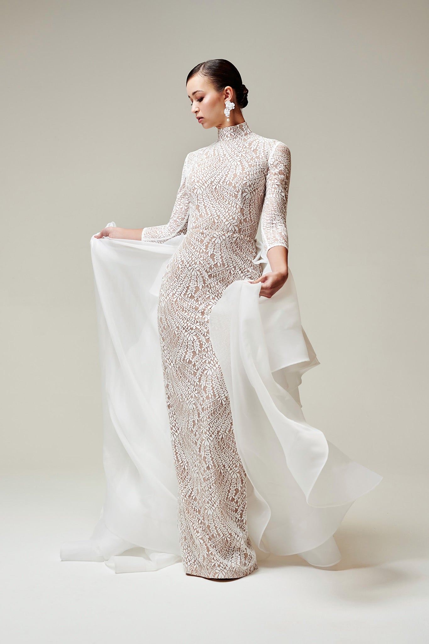 long sleeved bridal gown with outer skirt