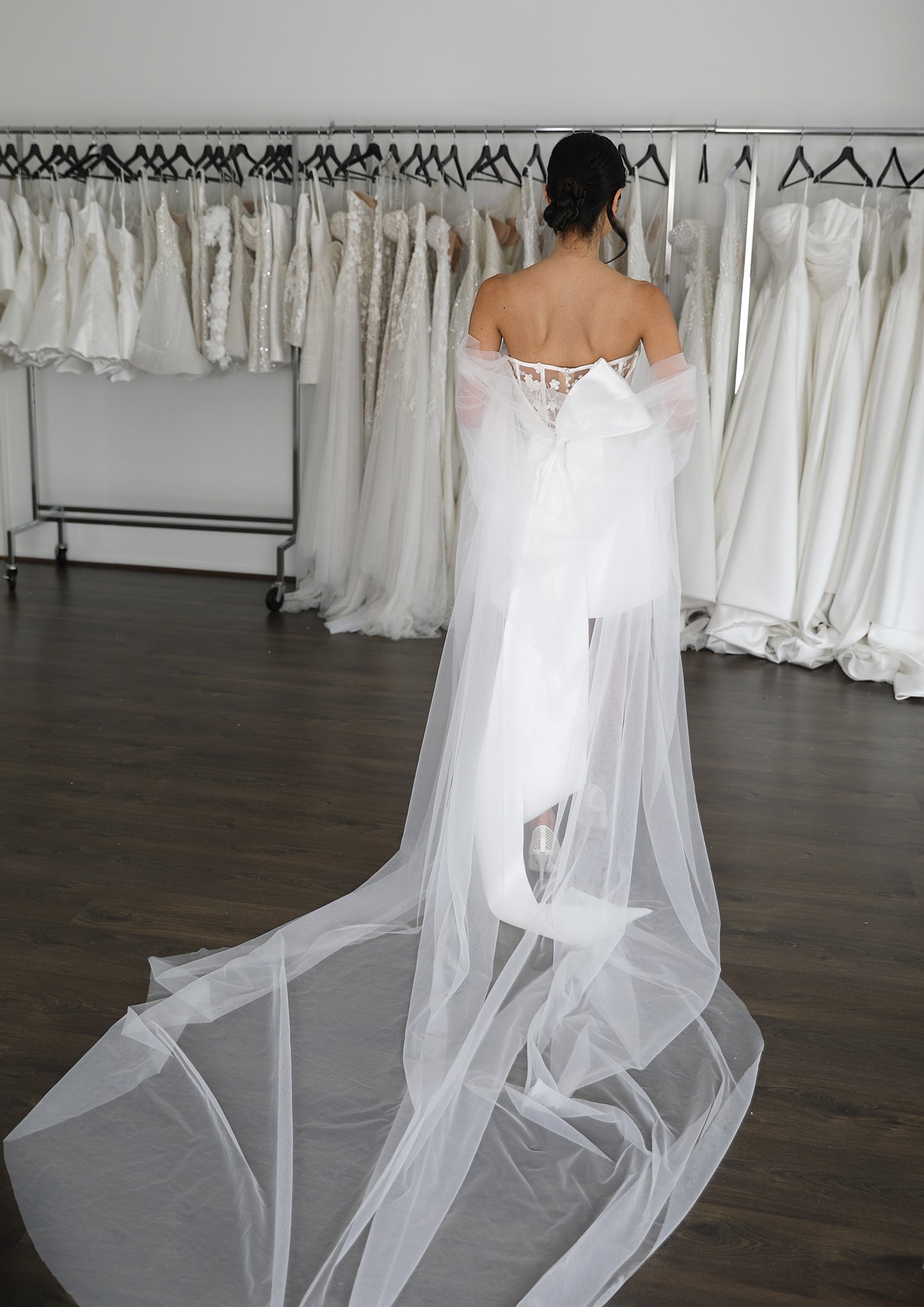 long tulle cape on bride