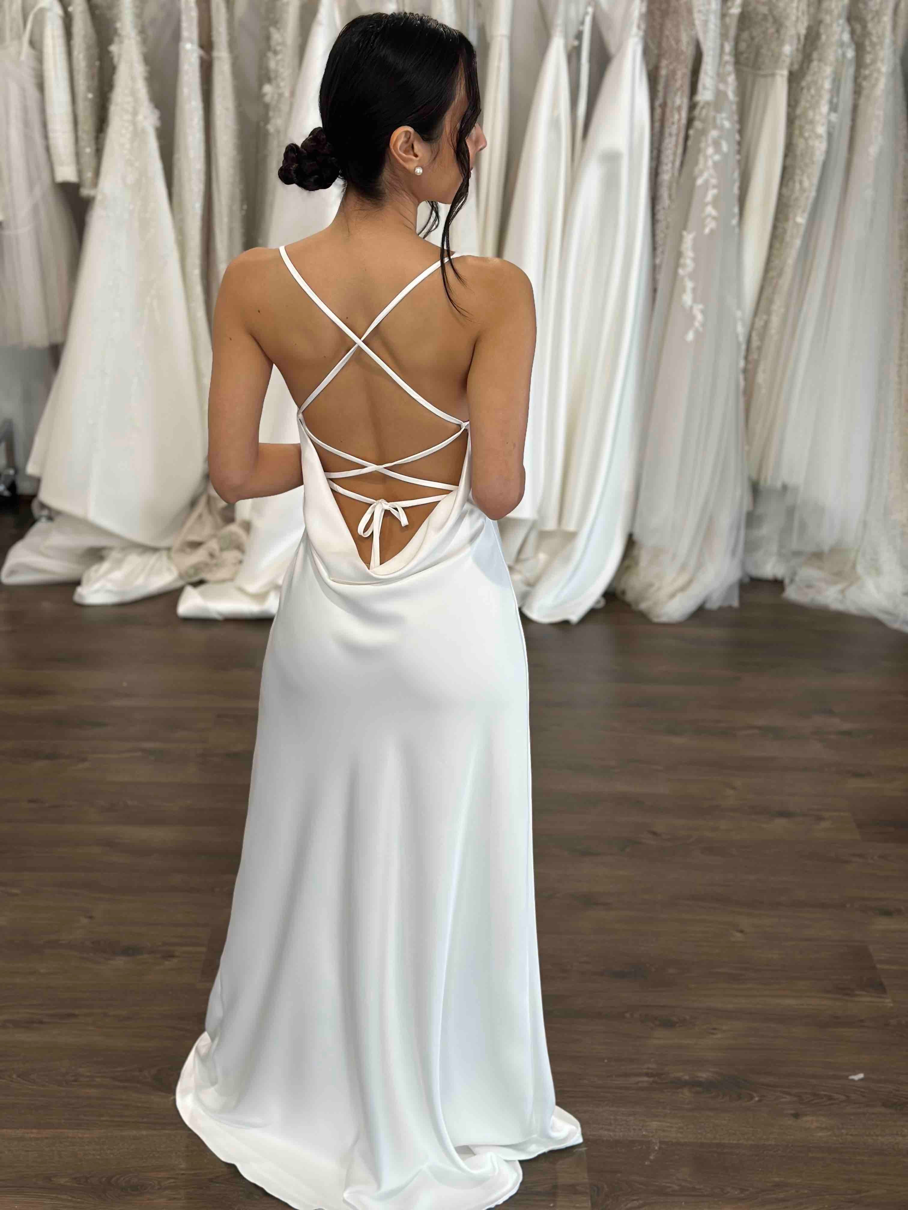 low back cowl with straps across the back on white slip dres