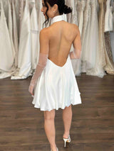 low back white mini dress with bubble hem