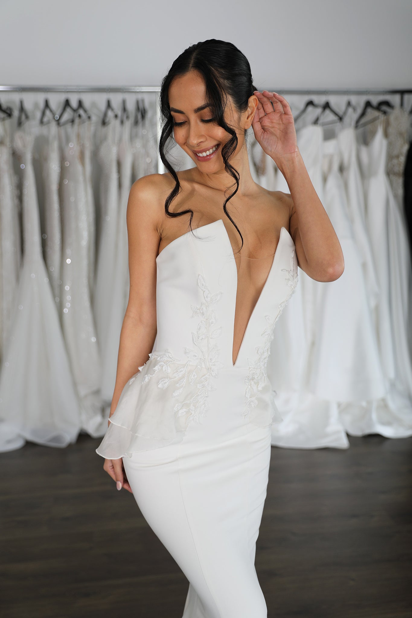 low cut v-neck wedding dress with lace peplums