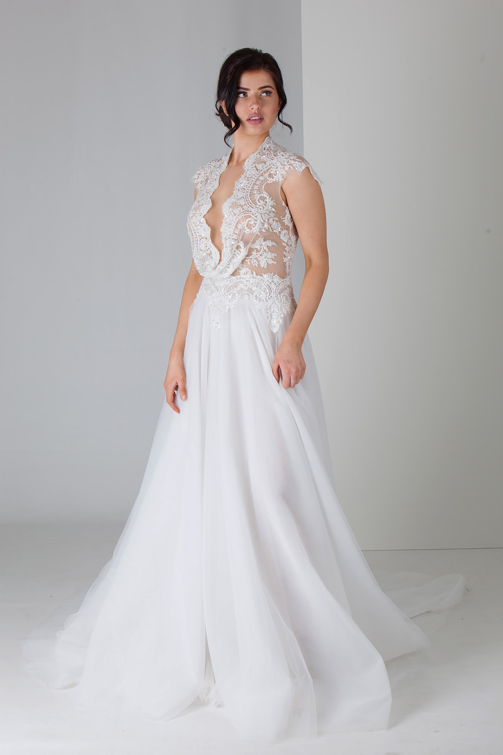 low cut v-neckline wedding gown with full tulle skirt