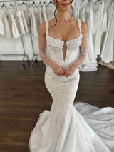 model wearing pearl wedding gown and tulle gloves