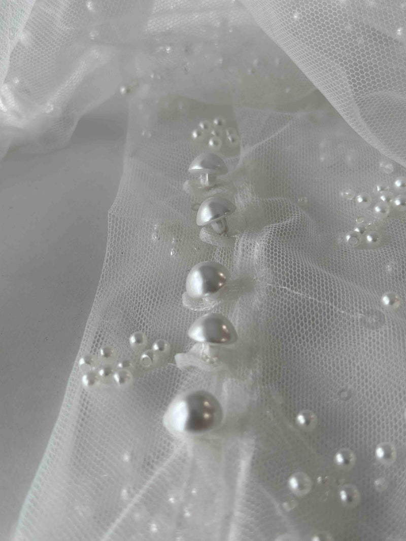 pearl button details on tulle bridal gloves