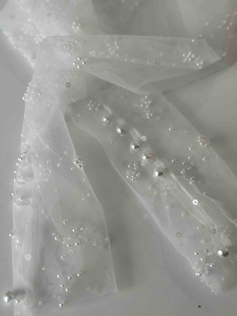 pearl buttons on tulle with pearl embellishments
