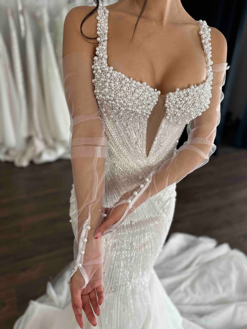 pearl closure gloves on model wearing pearl wedding dress