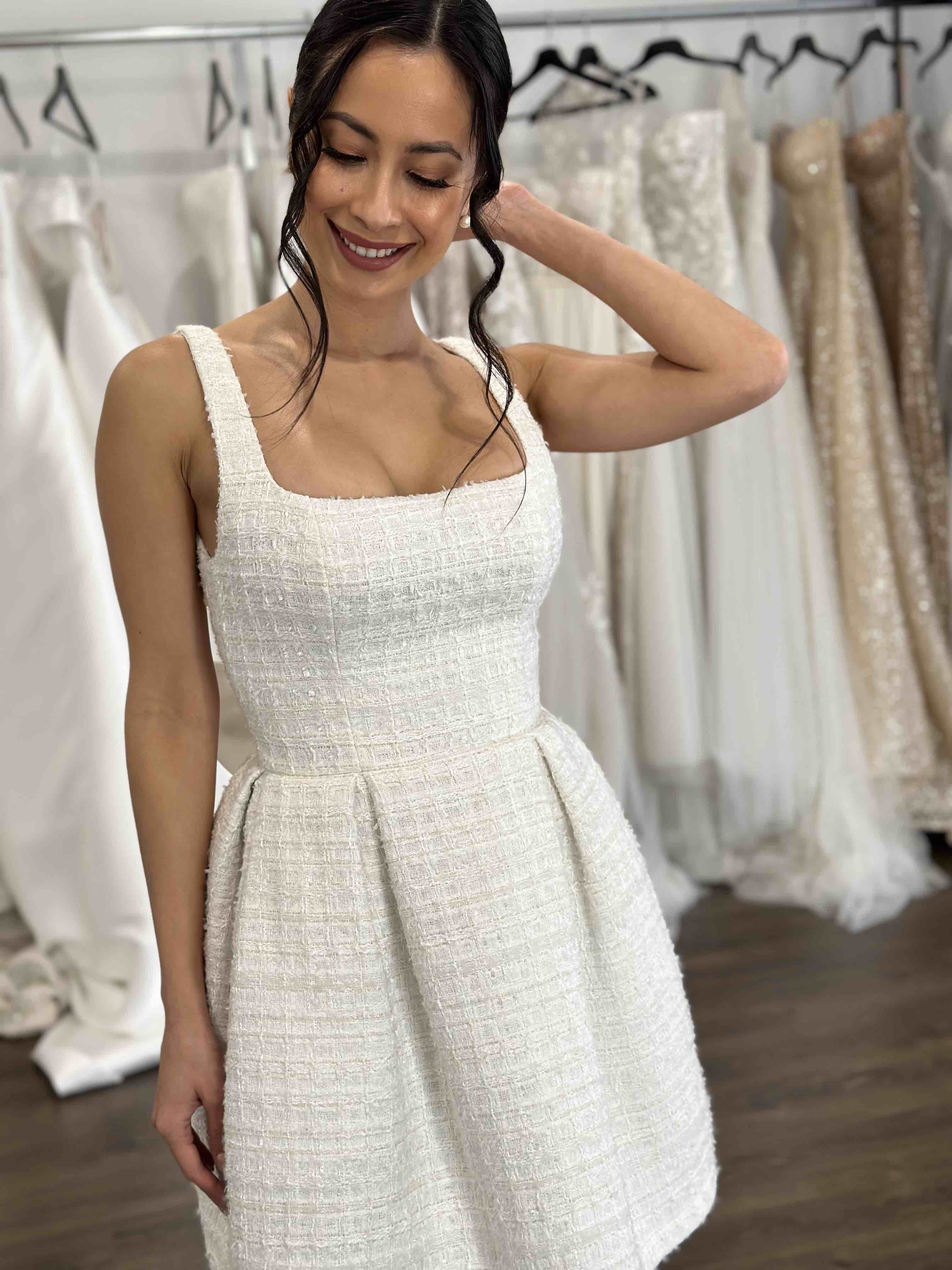smiling woman wearing u-neck bridal mini dress