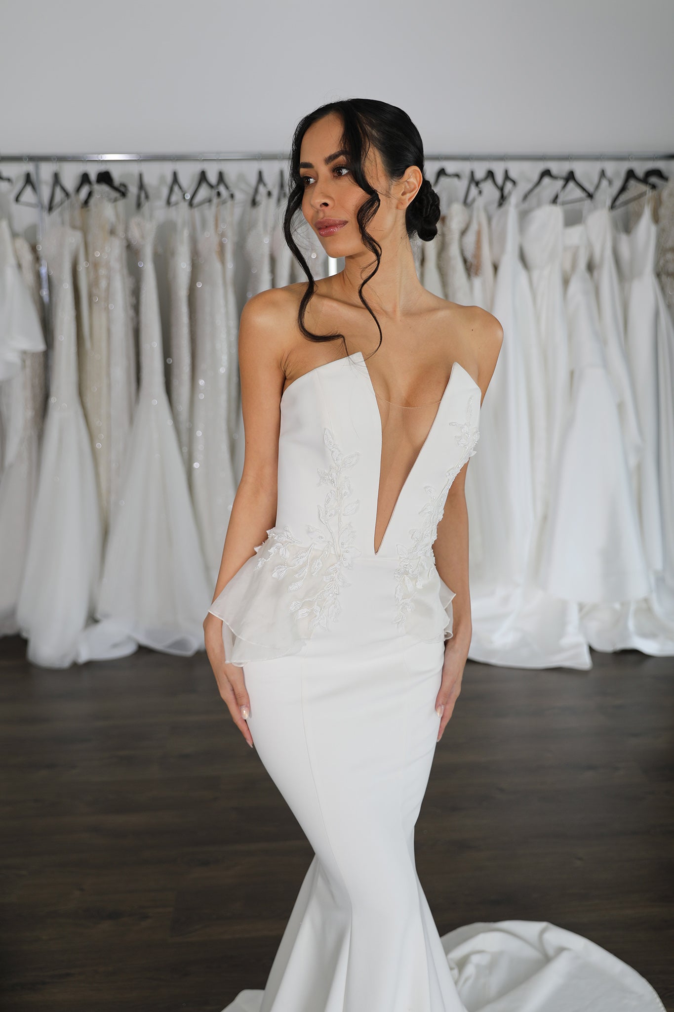 striking plunging v-neckline wedding dress with mermaid skirt and side lace peplums