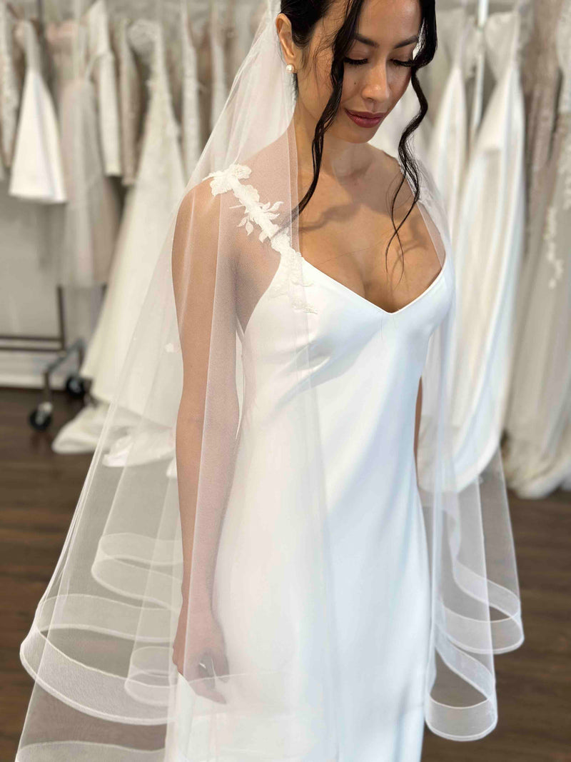 tulle bridal veil with crinoline hem worn by model