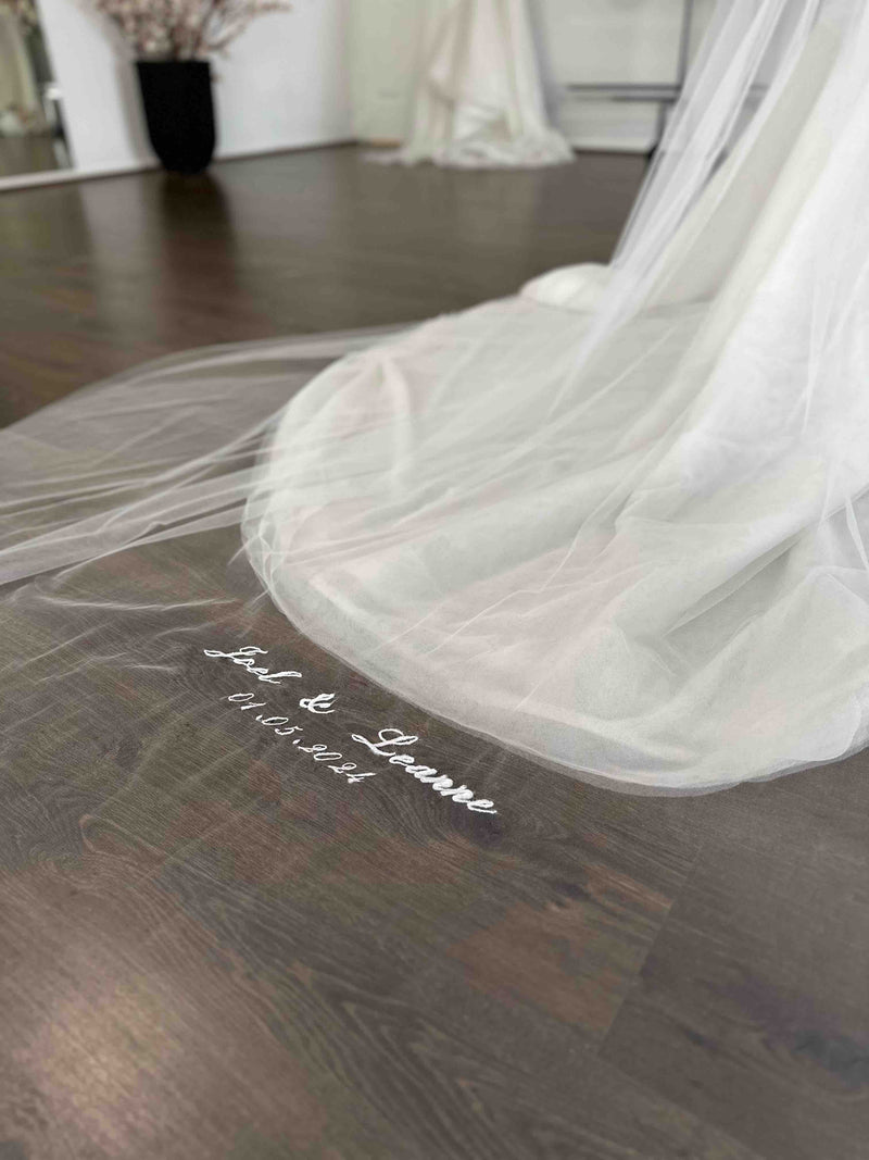 veil with names and dates embroidered onto it