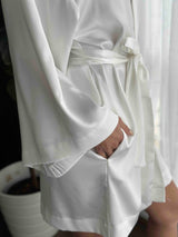 white bridal robe with waist band tied in a bow