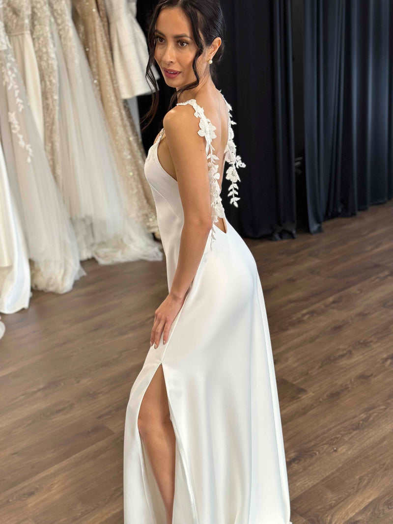 white bridal slip dress with skirt split and floral lace straps