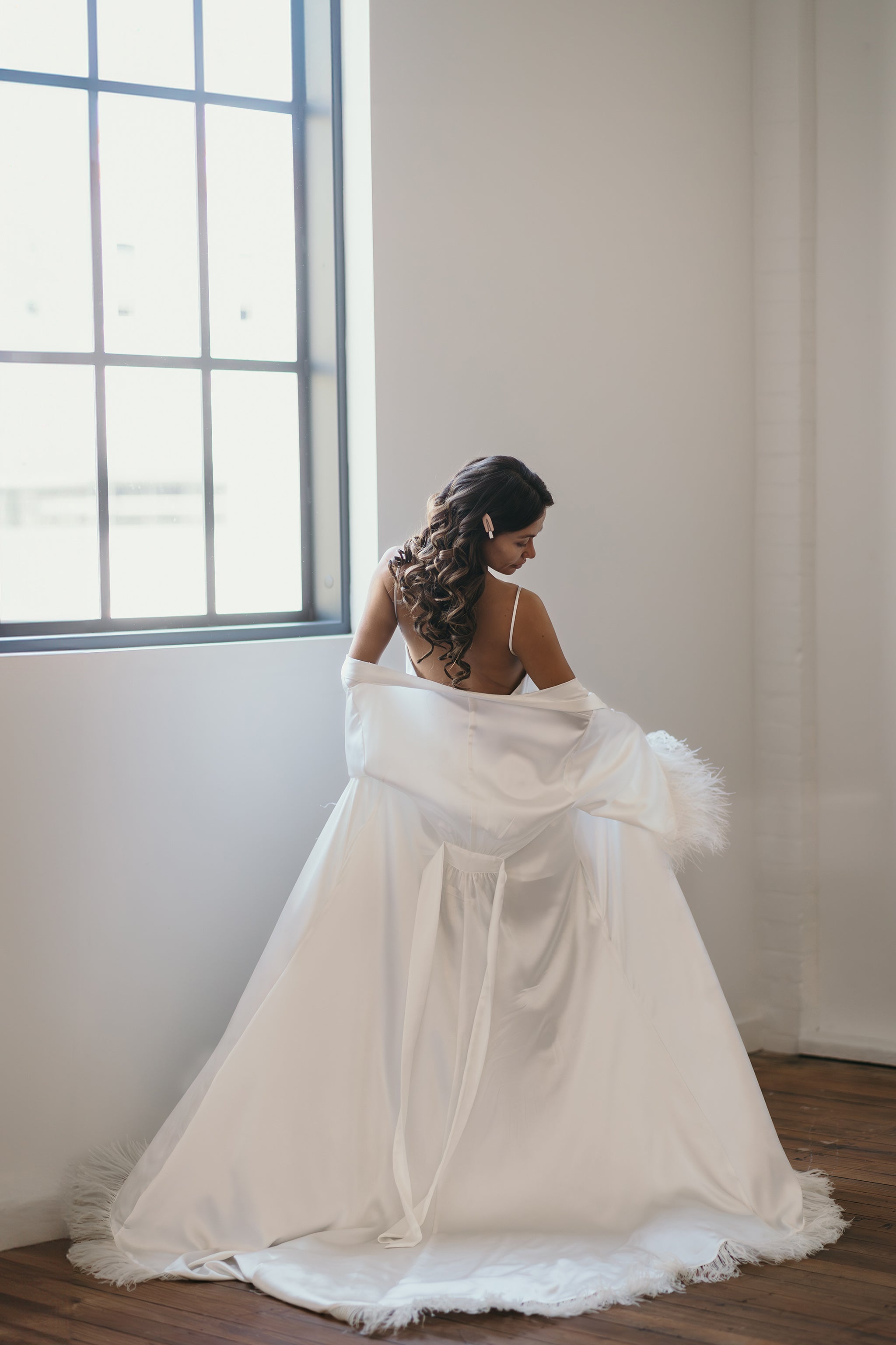 white long flowing bridal robe with feathers