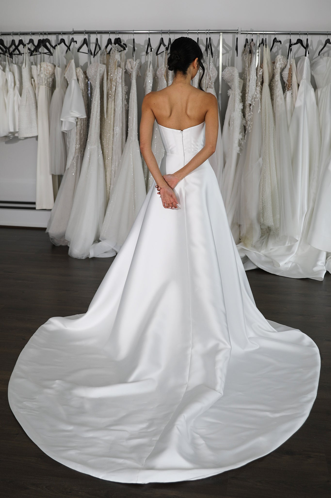 white mikado wedding dress with no straps and a dramatic skirt train