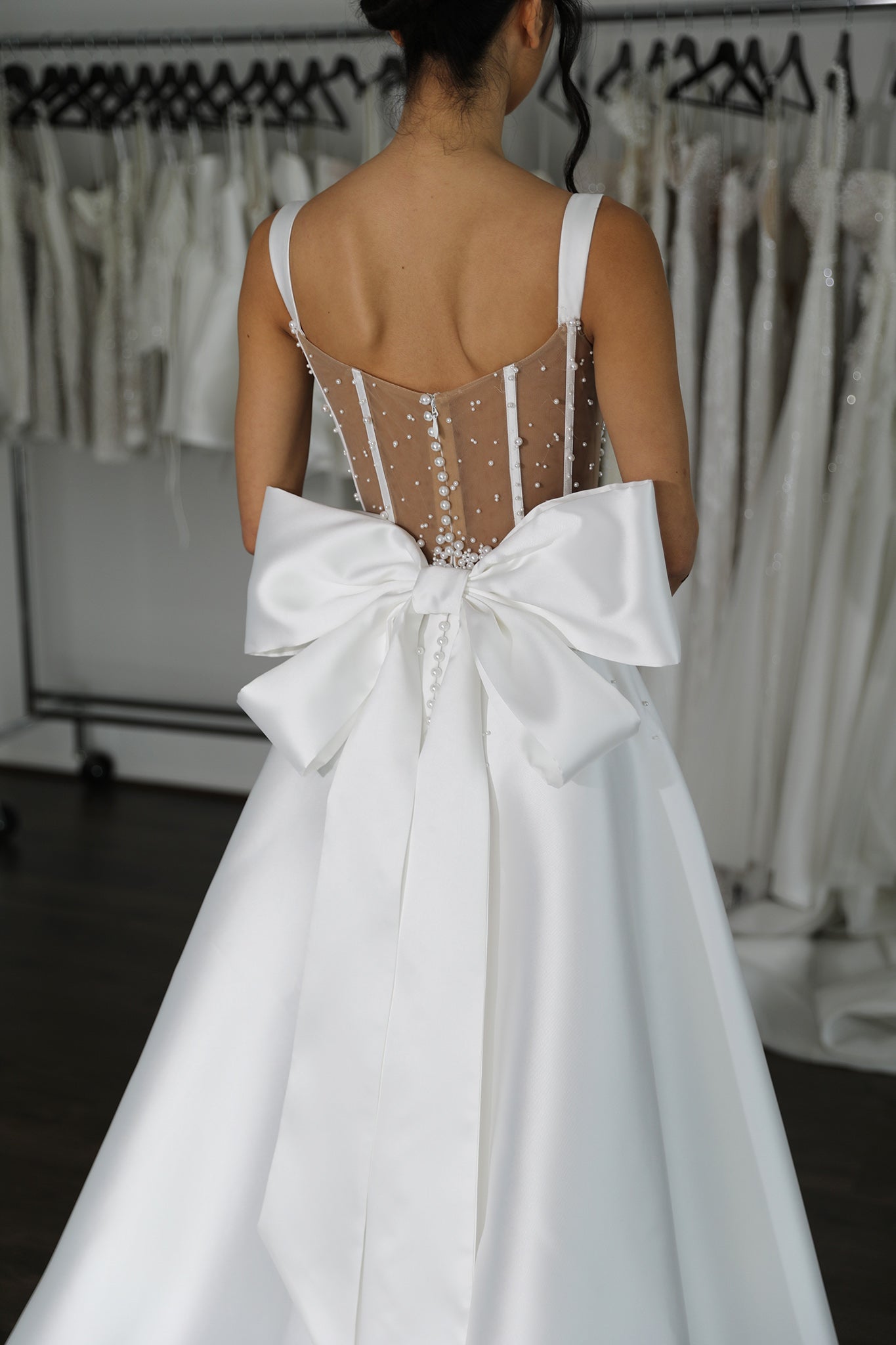 white mikado wedding gown with tiered mikado bow detail