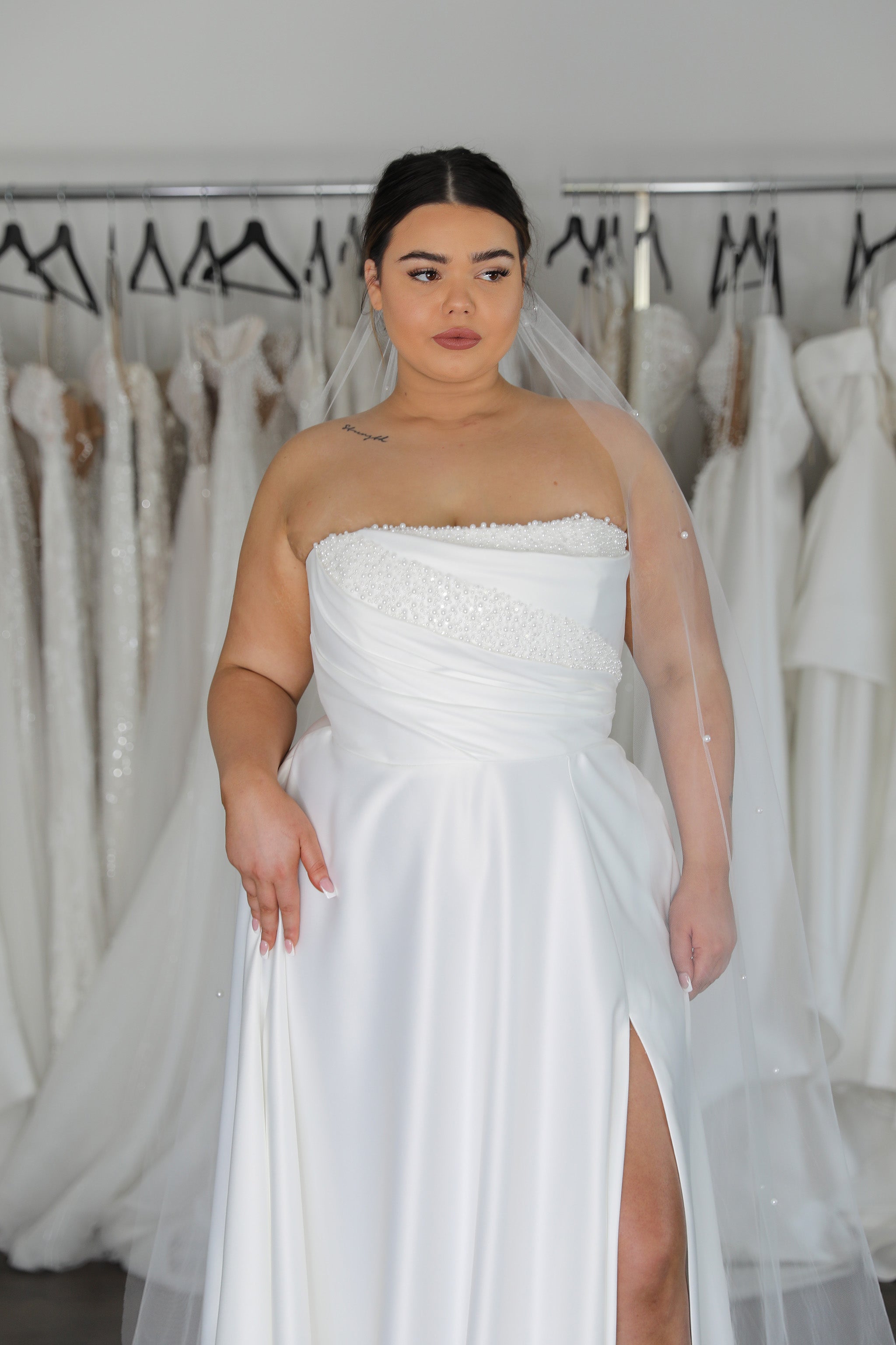 white pearl neck wedding gown and veil