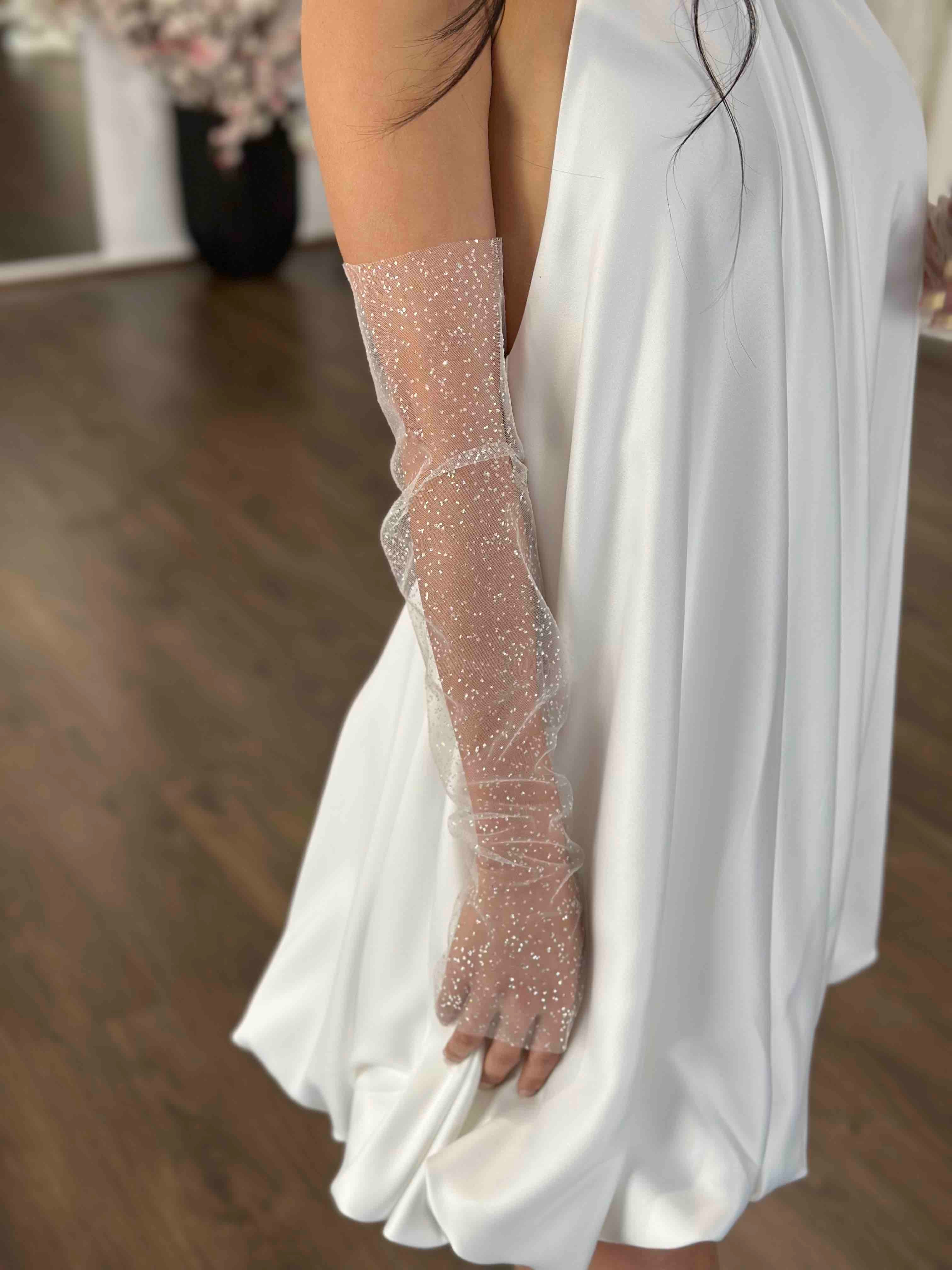 white short dress and glittery tulle bridal sleeves