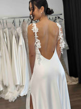 white slip dress with thigh high split and floral leaf lace straps