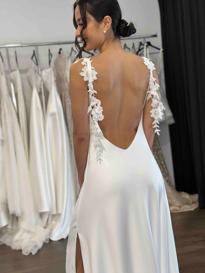 white slip dress with thigh high split and floral leaf lace straps