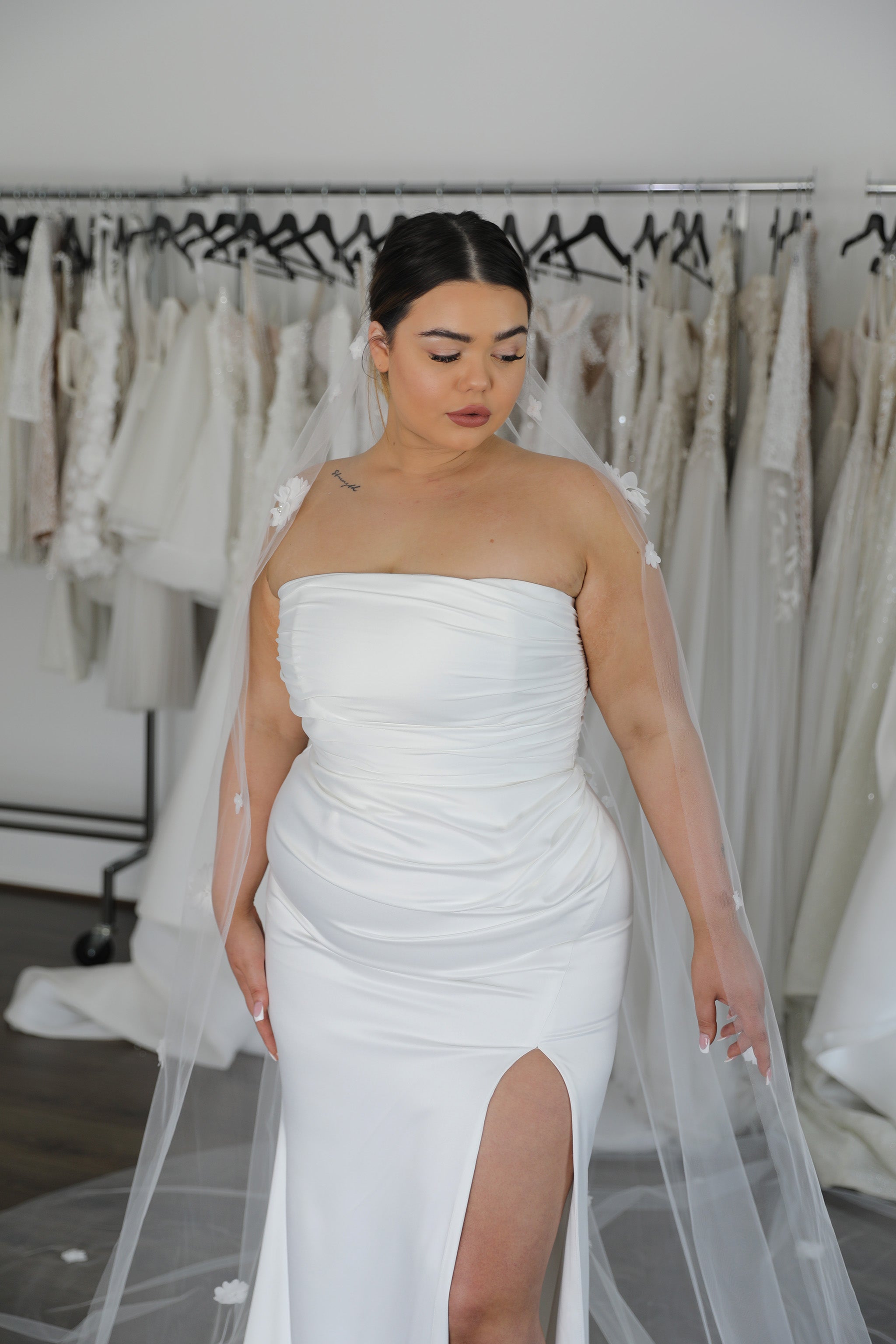 white strapless dress and tulle veil