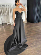 woman in black strapless evening gown