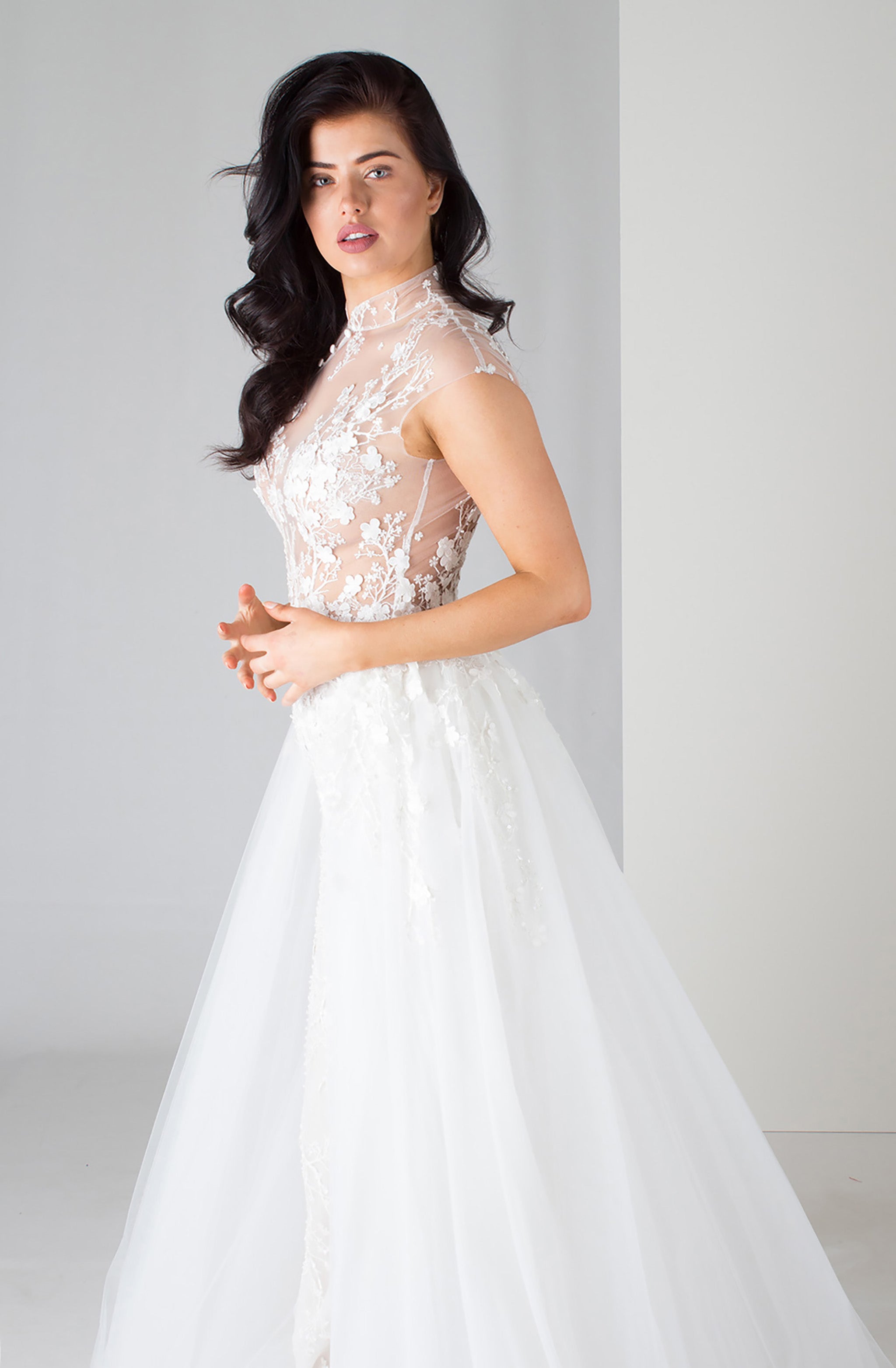 woman in floral lace wedding dress with high neckline