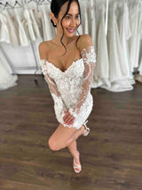 woman in wedding dress and gloves posing