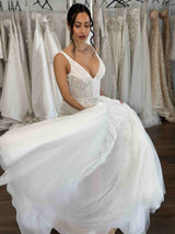 woman toiling in her full length wedding dress with long flowing skirt