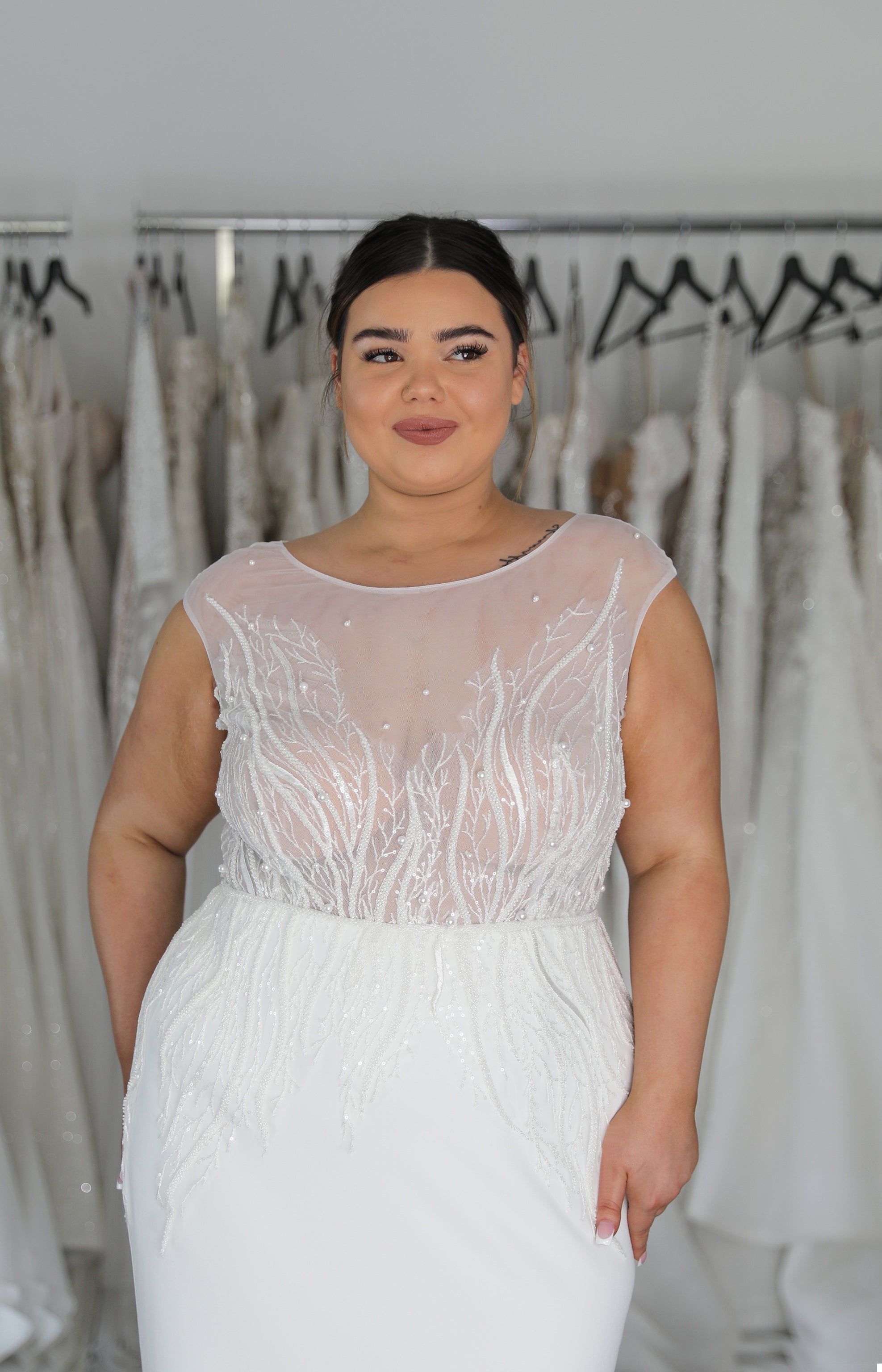 woman wearing lace top wedding dress with white skirt