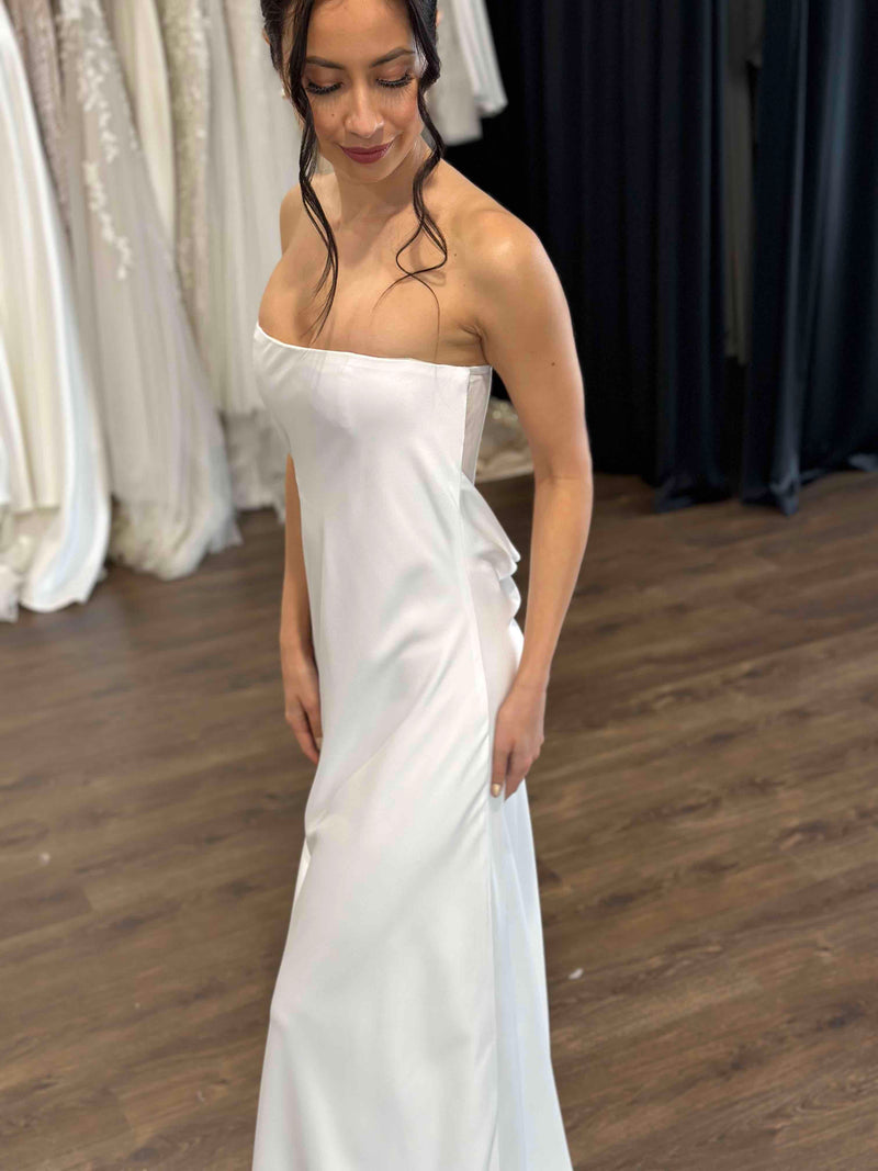 woman wearing white strapless slip dress