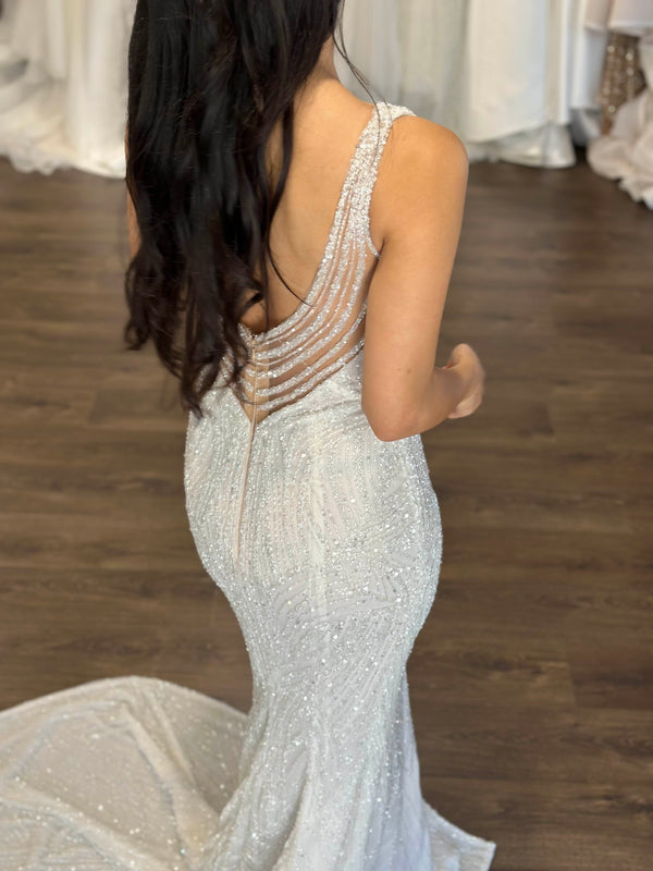 beaded bridal gown with U-back on black haired model