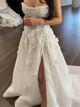 beaded lace wedding dress with pearls on the bodice and thigh high split