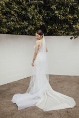 bride in wedding gown with tulle long veil