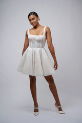 bride wearing U-neck mini reception dress
