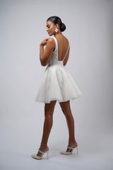 model posing in lace bridal mini reception dress