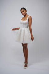 model posing in lace mini wedding dress with U-neck