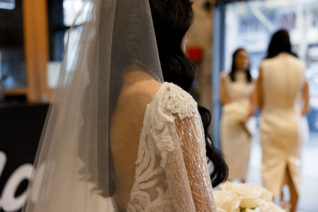 tulle veil with blusher in brides hair