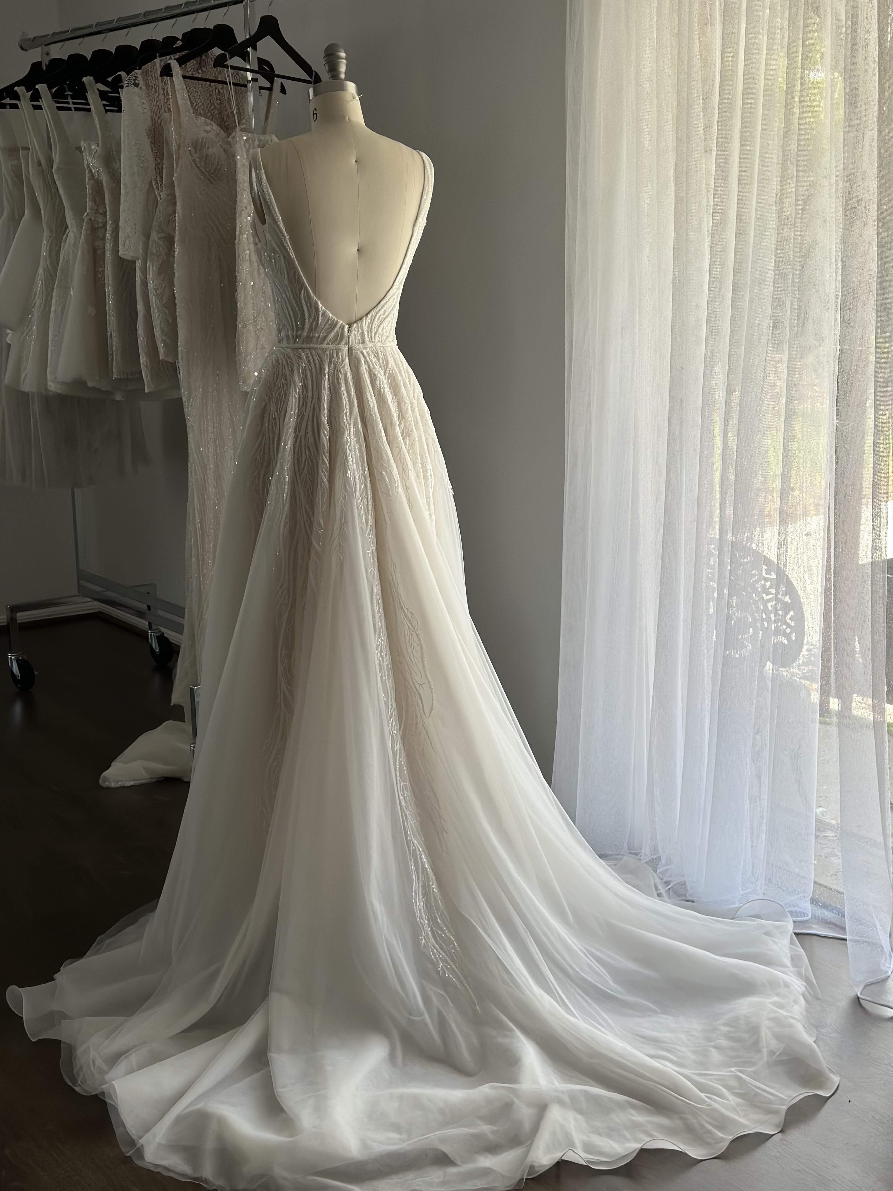 wedding dress on dress form in showroom