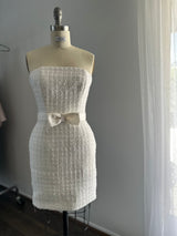 white bridal mini tube dress on dress form in studio